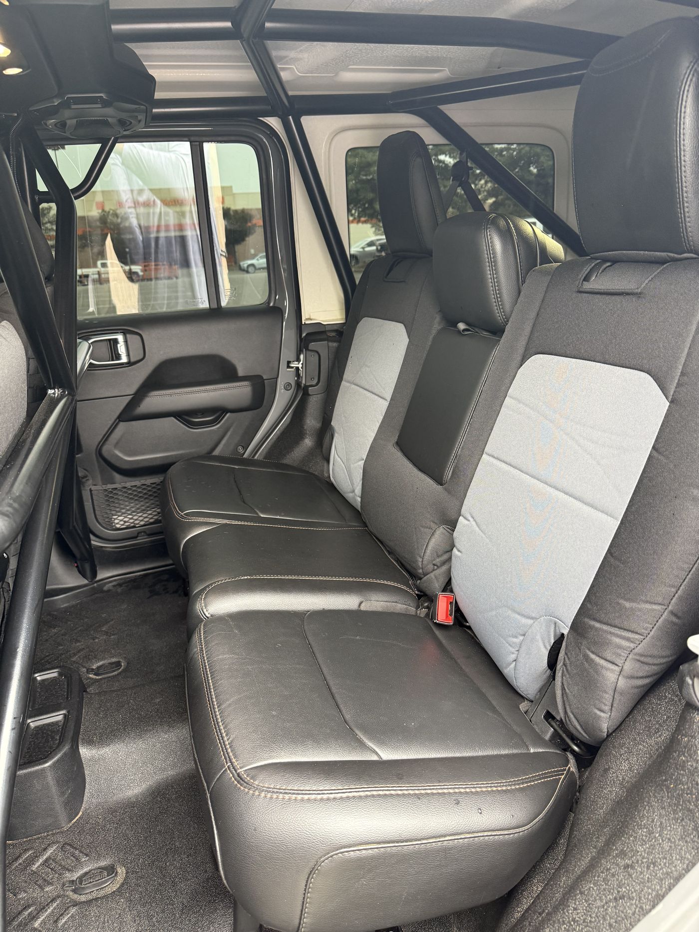 Rear seat detail with tactical seat covers and clean interior