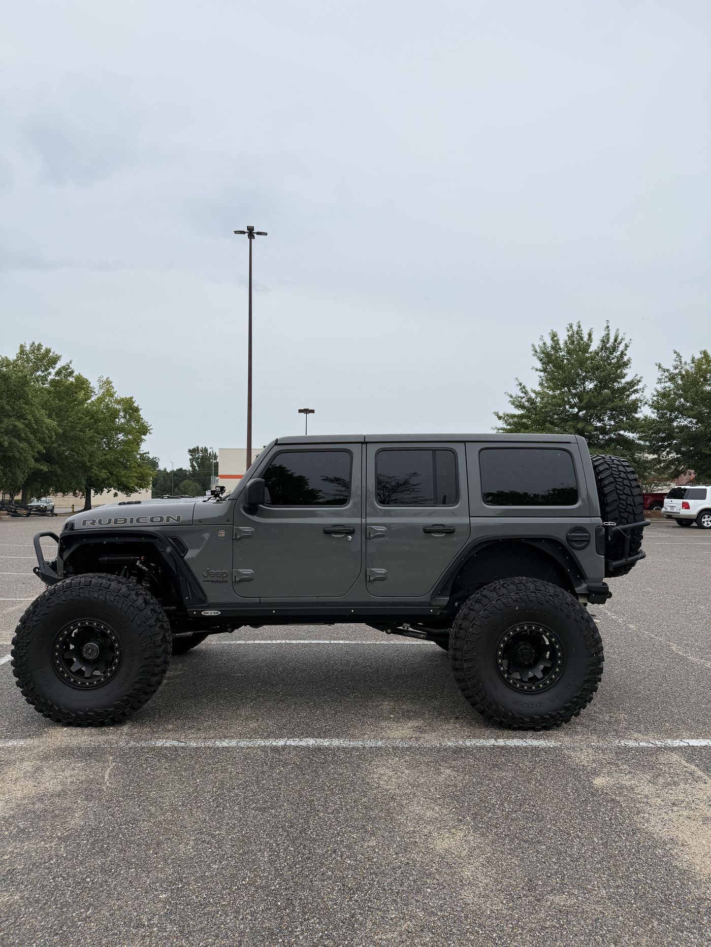 Driver side profile showing full build stance