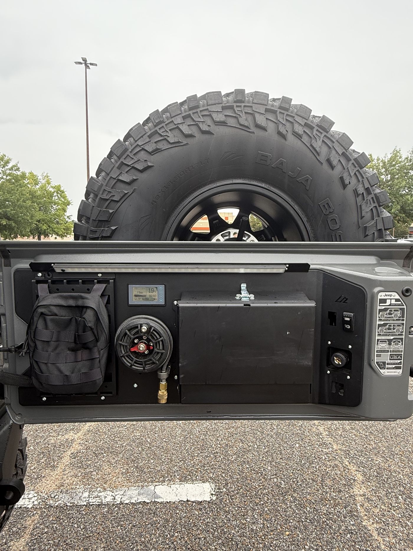American Adventure Lab TACS tailgate system with ARB twin compressors, Apex reel, battery monitor, and MOLLE panel